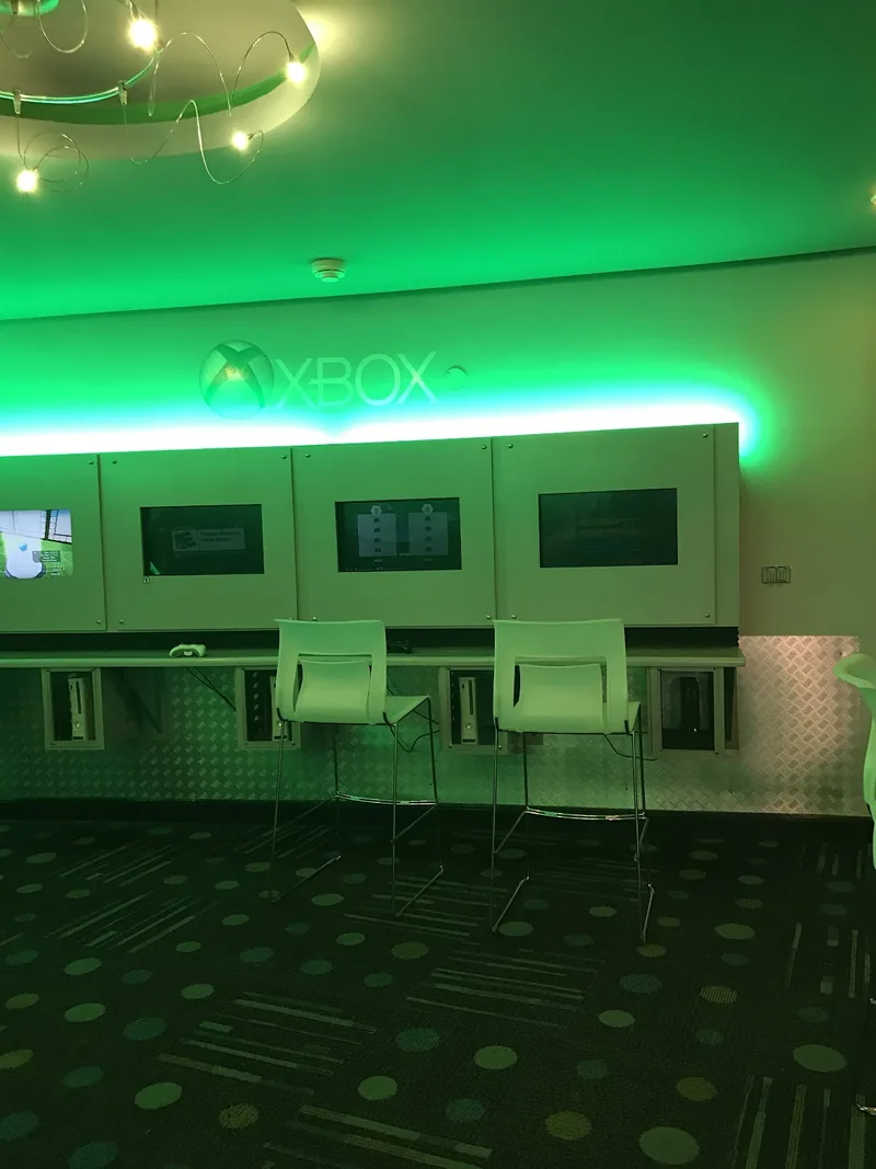 Resort gaming area with Xbox stations and seating